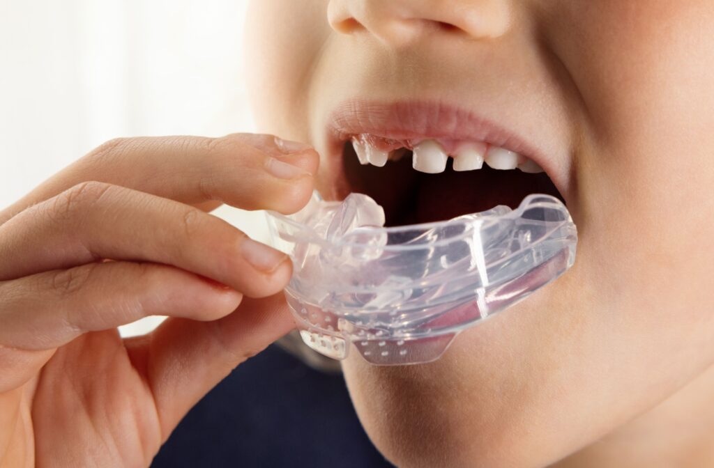 A child is shown using a myobrace appliance to keep their jaw aligned.